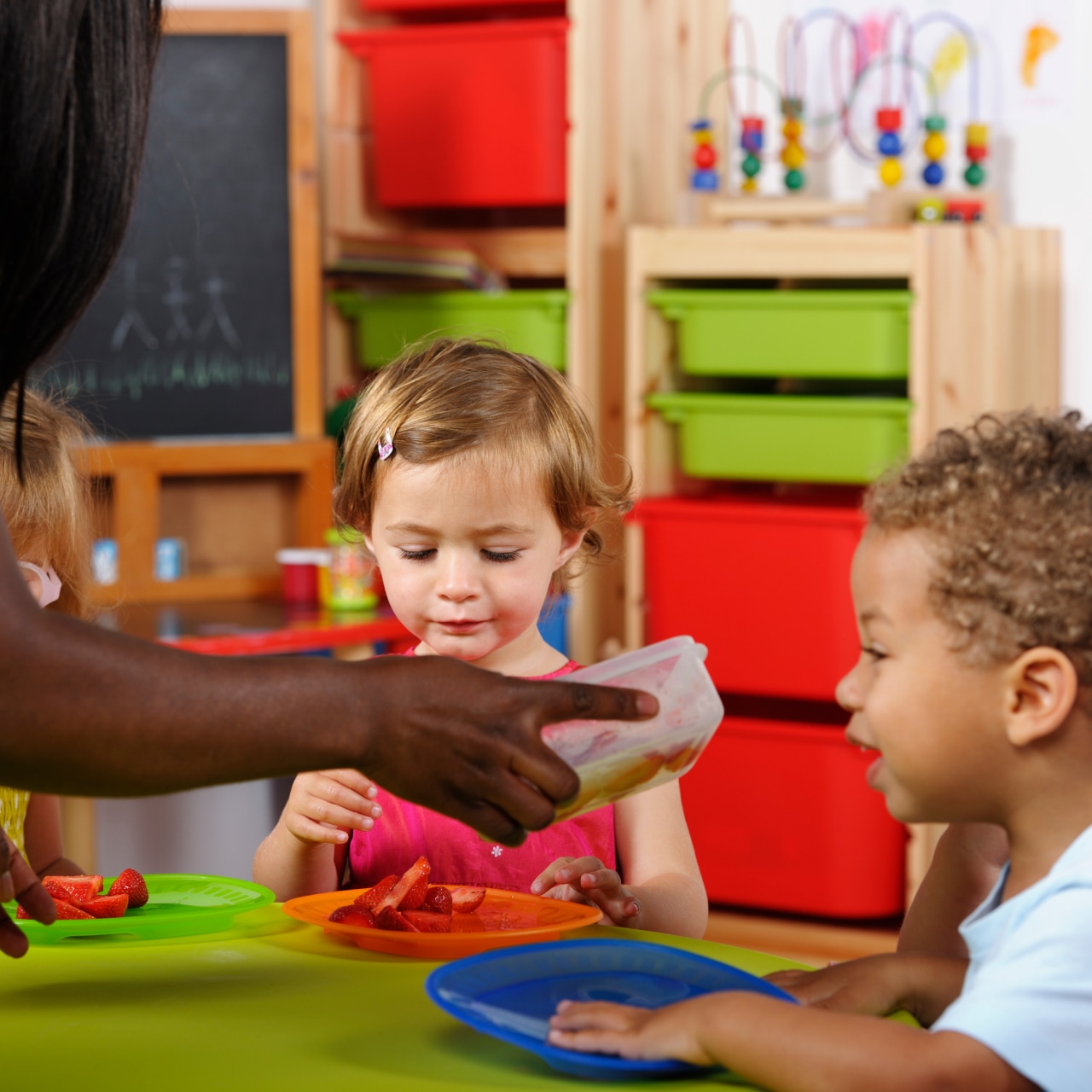 Two kids eating together (Daycare)